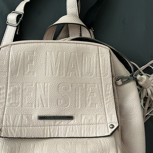 This is a light pink mini back pack that is very spacious and cute. - Picture 3 of 3